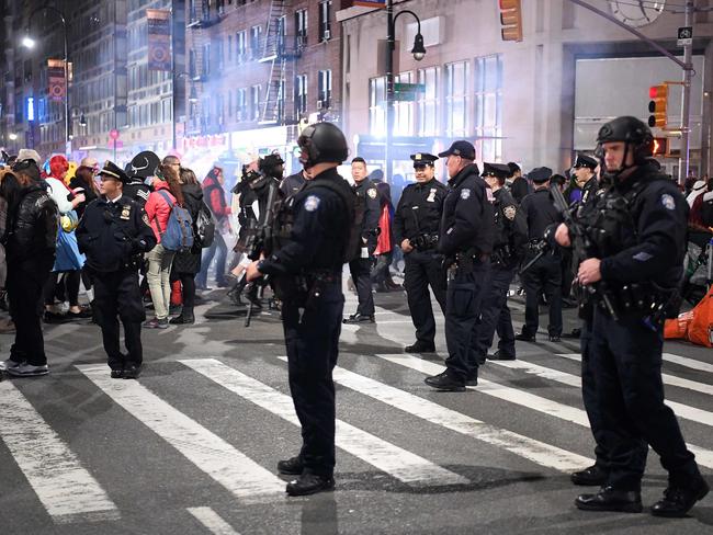 NYPD officers stand guard during the 44th annual Halloween Parade in New York. Picture: AFP