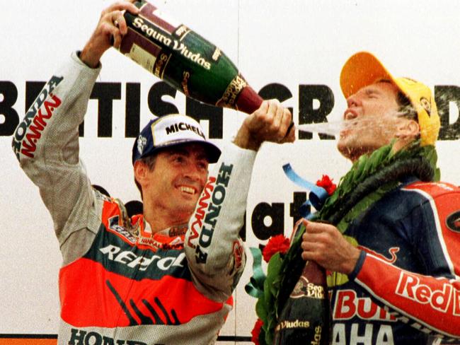 Mick Doohan celebrates Simon Crafar’s British GP win at Donington Park in July 1998.