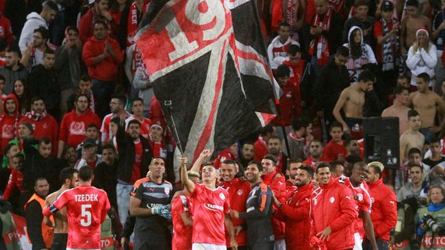 Hapoel's players celebrate after winning the UEFA Europa League game.
