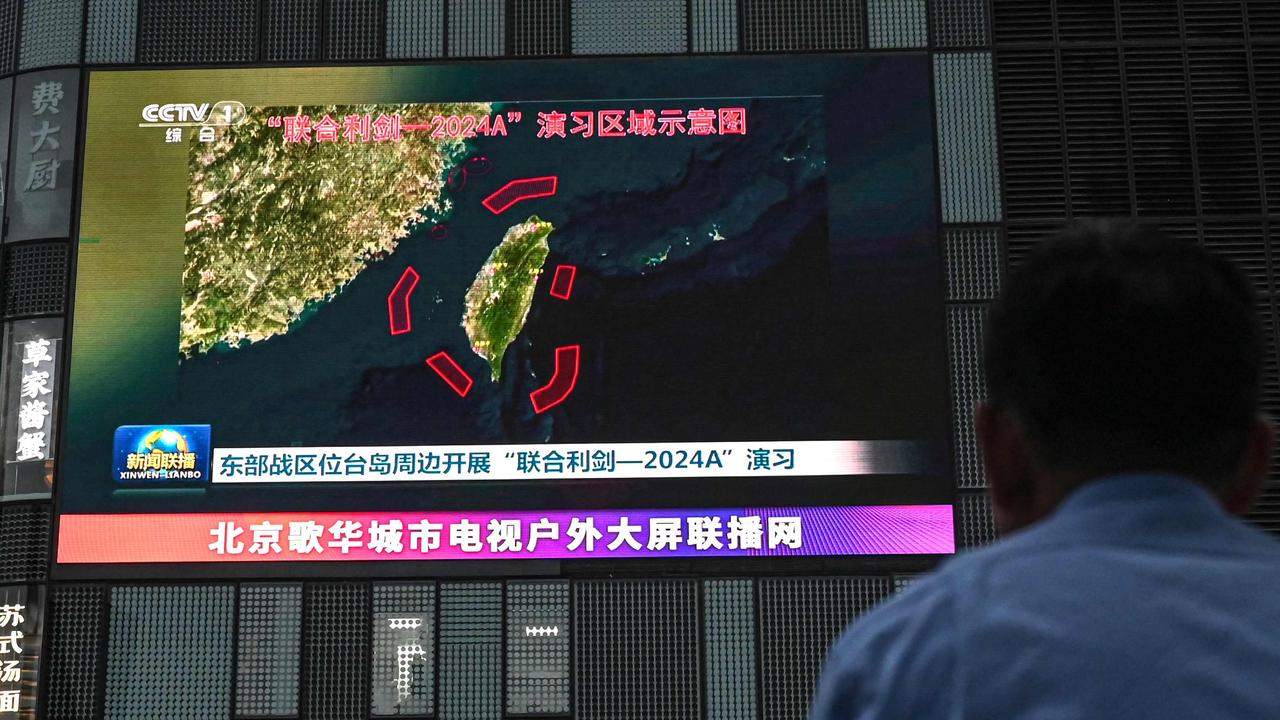 News coverage is shown of China’s military drills around Taiwan, in Beijing, as tensions over Taiwan and the South China Sea escalate. Picture: Jade Gao/AFP