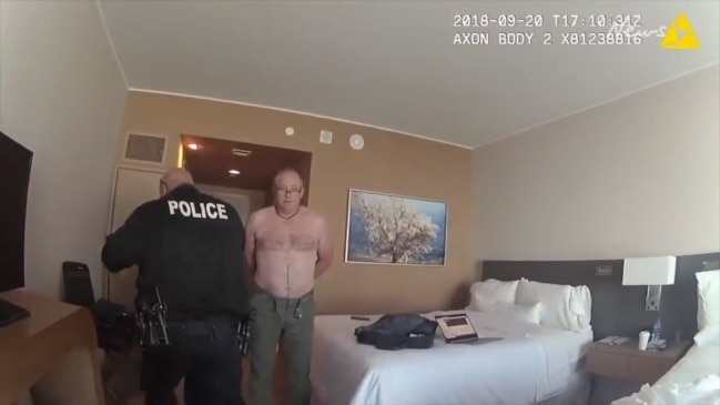 Man arrested for being naked in hotel room window