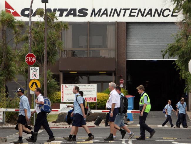 Engineers leave the Qantas Maintenance Facility at Tullamarine Airport, Melbourne, at the end of their shift.