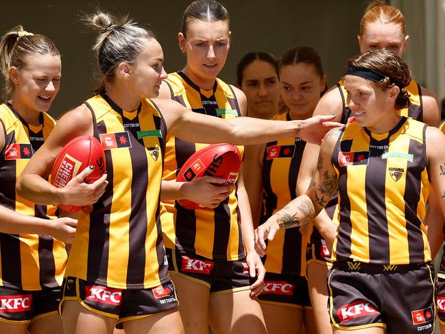 MELBOURNE, AUSTRALIA - NOVEMBER 10: Emily Bates (left) and Tilly Lucas-Rodd of the Hawks walk onto the field during the 2024 AFLW Second Qualifying Final match between the Hawthorn Hawks and the Brisbane Lions at IKON Park on November 10, 2024 in Melbourne, Australia. (Photo by Michael Willson/AFL Photos via Getty Images)