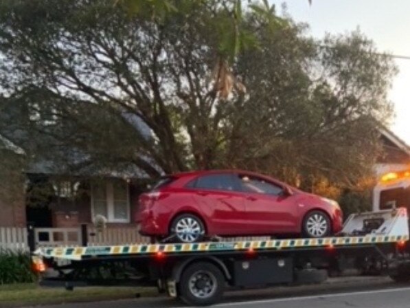 A car is towed after a crash at the intersection.