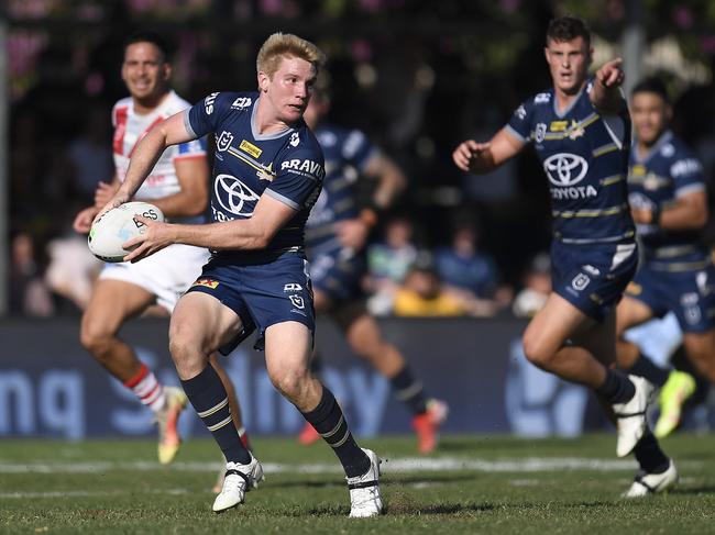 Tom Dearden of the Cowboys passes the ball during the round 24 NRL match between the St George Illawarra Dragons and the North Queensland Cowboys at Browne Park. (Photo by Ian Hitchcock/Getty Images)