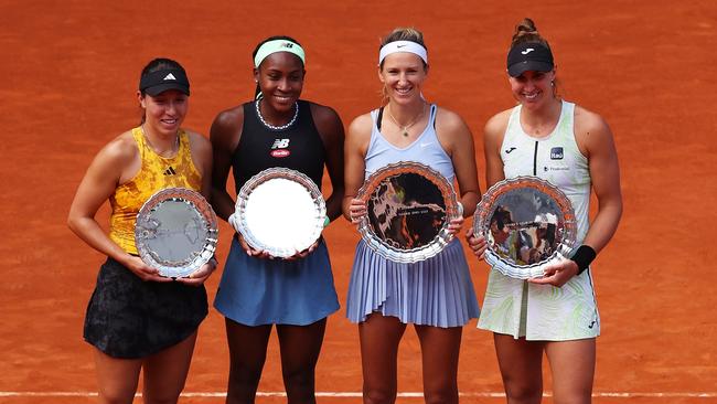 MADRID, SPAIN - MAY 07: (L-R) Runners up Coco Gauff and Jessica Pegula of United States and Winners Victoria Azarenka and Beatriz Haddad Maia of Brazil pose while holding their trophy's after the Woman's Doubles Final match on Day Fourteen of the Mutua Madrid Open at La Caja Magica on May 07, 2023 in Madrid, Spain. (Photo by Julian Finney/Getty Images)