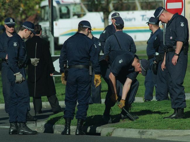 A police line searches for evidence in Moorabbin.