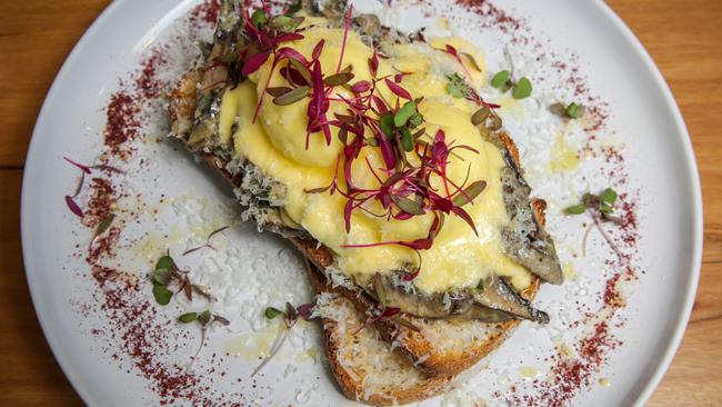 Forty Flips Cafe’s mushroom ragout on sourdough with two poached eggs and hollandaise. Picture: Nicole Cleary