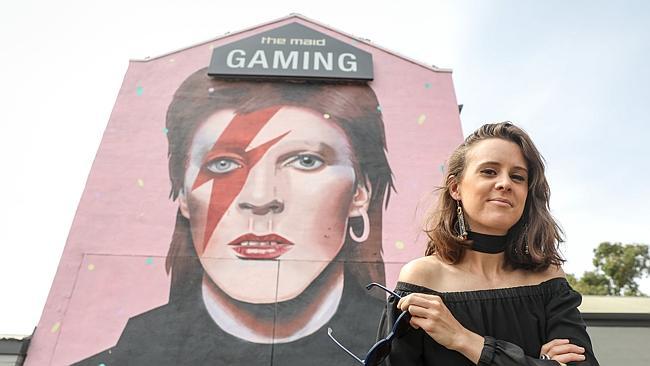 Artist Lisa King with her David Bowie mural. Picture: Russell Millard