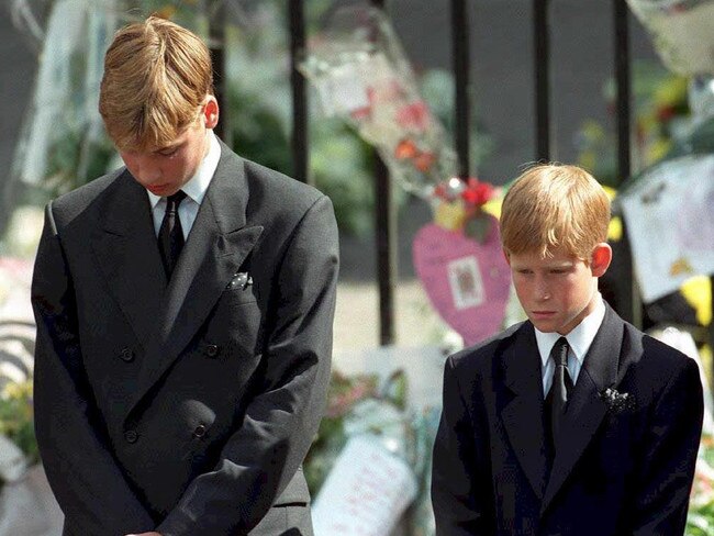 Prince William (left) and Prince Harry, the sons of Princess Diana, bowing their heads as their mother’s coffin is taken out of Westminster Abbey following her funeral service. Picture: Adam Butler/AFP