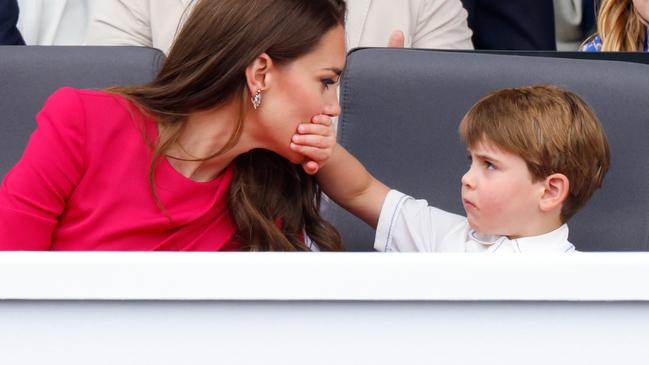 LONDON, UNITED KINGDOM - JUNE 05: (EMBARGOED FOR PUBLICATION IN UK NEWSPAPERS UNTIL 24 HOURS AFTER CREATE DATE AND TIME) Prince Louis of Cambridge covers his mother Catherine, Duchess of Cambridge's mouth with his hand as they attend the Platinum Pageant on The Mall on June 5, 2022 in London, England. The Platinum Jubilee of Elizabeth II is being celebrated from June 2 to June 5, 2022, in the UK and Commonwealth to mark the 70th anniversary of the accession of Queen Elizabeth II on 6 February 1952. (Photo by Max Mumby/Indigo/Getty Images)