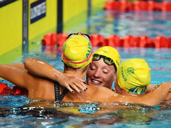 Ariarne Titmus, Jessica Ashwood and Kiah Melverton of Australia celebrate following the Women's 800m Freestyle Final