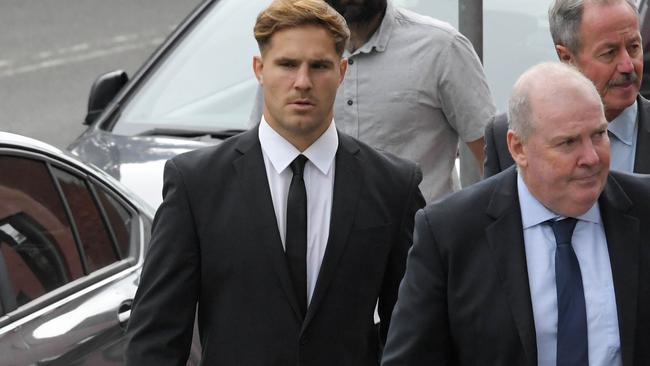 NRL player Jack De Belin (centre) arrives at Wollongong Courthouse for the continuing rape trial. Picture: NCA NewsWire / Simon Bullard