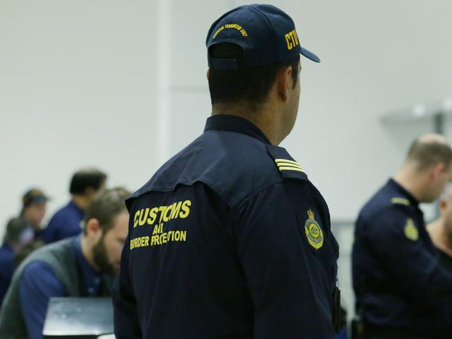 ## The Aus has agreed to and MUST pixelate the faces of any officers in this set of pictures ## CTU (The Border Force Counter-Terrorism Unit) Australian Border Force Officers working at Sydney International Airport. Pic - Britta Campion