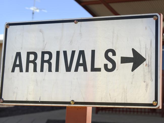 FIFOs (fly in fly out) mine workers in Coober Pedy - Coober Pedy airport 'arrivals' sign.