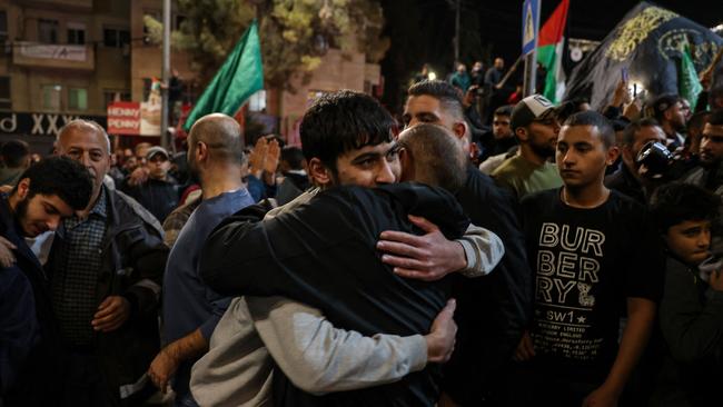 A young Palestinian is welcomed by a relative after being released from Israeli jails. Picture: Ahmad Gharabli