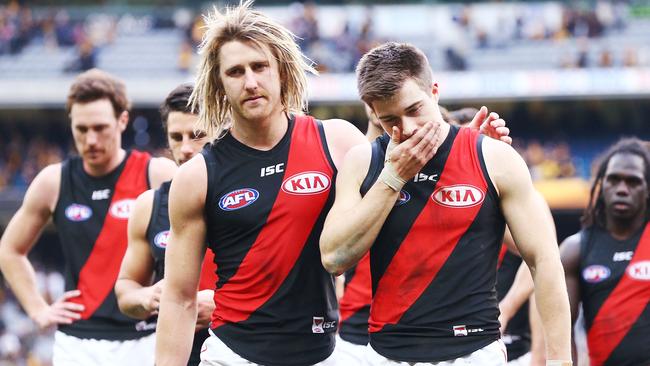 Dyson Heppell and Zach Merrett of the Bombers show their disappointment after the narrow round 20 loss to Hawthorn. Picture: Michael Dodge/Getty Images