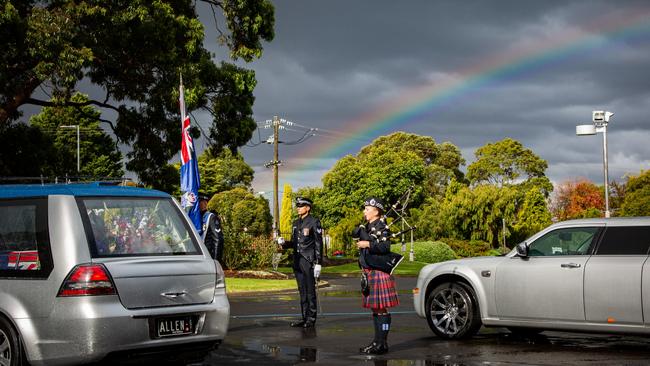 A rainbow shines through the darkened sky at Leading Senior Constable Lynette Taylor's funeral. Picture: Jesse Wray-McCann, Victoria Police