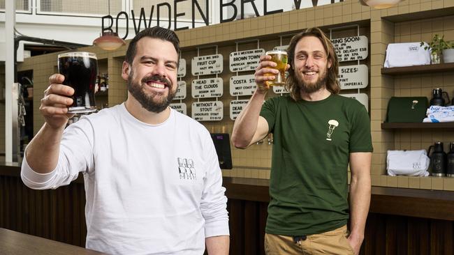 Jake Phoenix and Alex Marschall serving up beers at the new Bowden Brewing at Plant 3 that opens today in Bowden, Monday, July 5, 2021. Picture: MATT LOXTON.