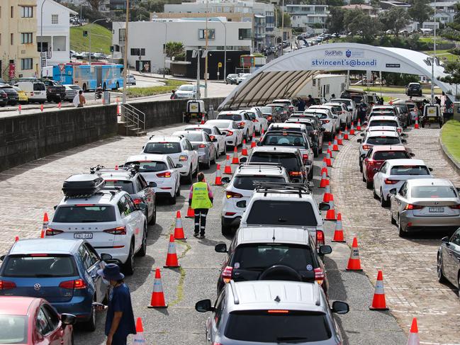 SYDNEY, AUSTRALIA - JANUARY 01 2022: Health professionals are seen working on New Years Day at the Bondi Beach, Sydney Covid-19 drive thru testing site which is now screening the public prior to entering for only those who are considered close contacts or who have symptoms. Picture: Newscorp Daily Telegraph / Gaye Gerard