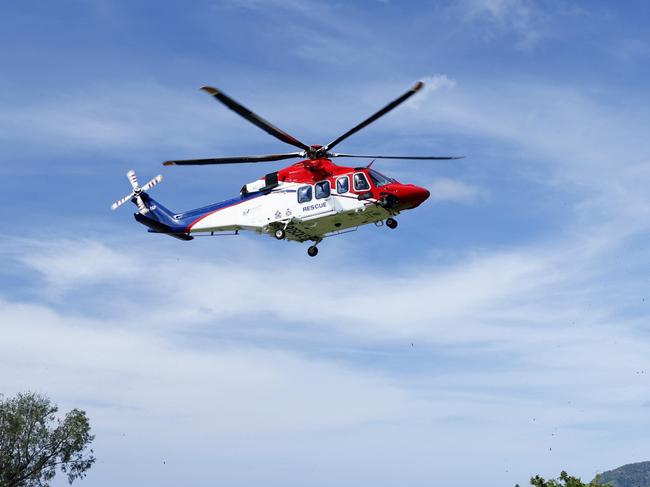 The QG Air 510 Rescue emergency services helicopter transports a 44 year old male spearfisherman to Cairns Hospital, after he was bitten multiple times by a 4.5 metre saltwater crocodile off Archer Point, south of Cooktown in Far North Queensland. Picture: Brendan Radke