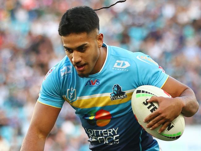 GOLD COAST, AUSTRALIA - JUNE 22: Alofiana Khan-Pereira of the Titans scores a try during the round 16 NRL match between Gold Coast Titans and New Zealand Warriors at Cbus Super Stadium, on June 22, 2024, in Gold Coast, Australia. (Photo by Chris Hyde/Getty Images)