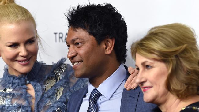 Australian actor Nicole Kidman poses for a photograph with Saroo Brierley and Sue Brierley as they arrive for the Australian premiere of Lion in Sydney on Monday, Dec. 19, 2016.