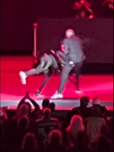 The moment the American comedian was clobbered on stage in Los Angeles by a 23-year-old rapper. Picture: Twitter/@pinatafarms