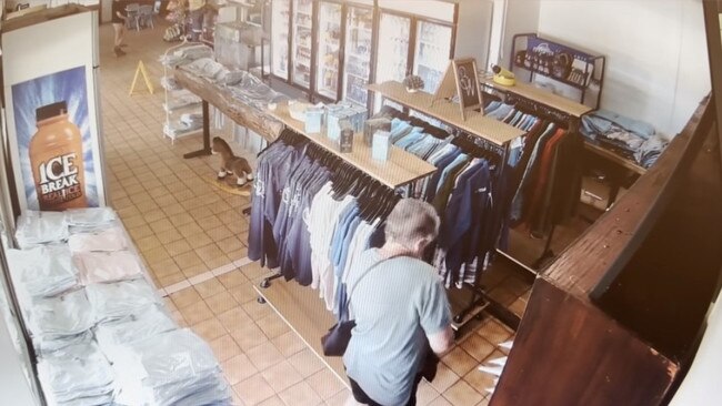 A woman has been caught on CCTV appearing to take shirts from a Queensland roadhouse. Picture: Supplied