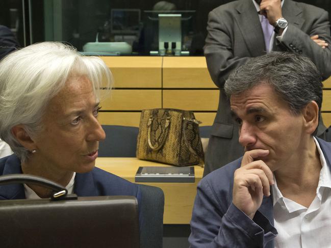 Greek Finance Minister Euclid Tsakalotos, right, speaks with Managing Director of the International Monetary Fund Christine Lagarde during a round table meeting of eurogroup finance ministers at the EU Lex building in Brussels on Sunday, July 12, 2015. Greece has another chance Sunday to convince skeptical European creditors that it can be trusted to enact wide-ranging economic reforms which would safeguard its future in the common euro currency. (AP Photo/Michel Euler)