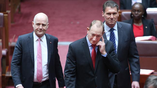 One Nation’s new Senator Fraser Anning was escorted into the chamber by senators Cory Benardi and David Leyonhjelm. Picture” Gary Ramage