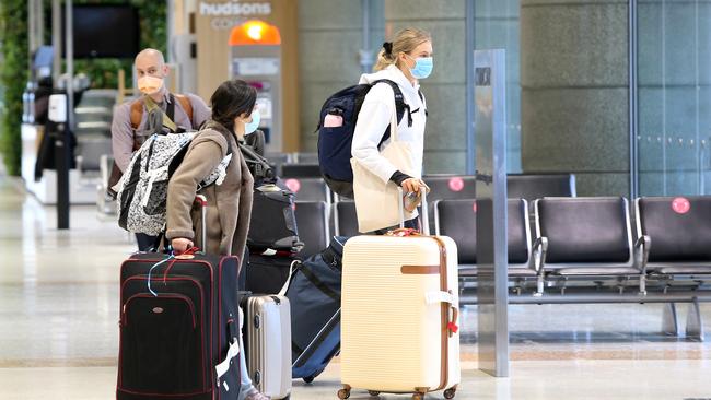 Transit passengers arriving in Sydney from Melbourne to board their international flights. Only those in transit or with special permission can now cross the NSW/Victoria boarder due to the Victorian Covid19 lock down. Picture: Richard Dobson