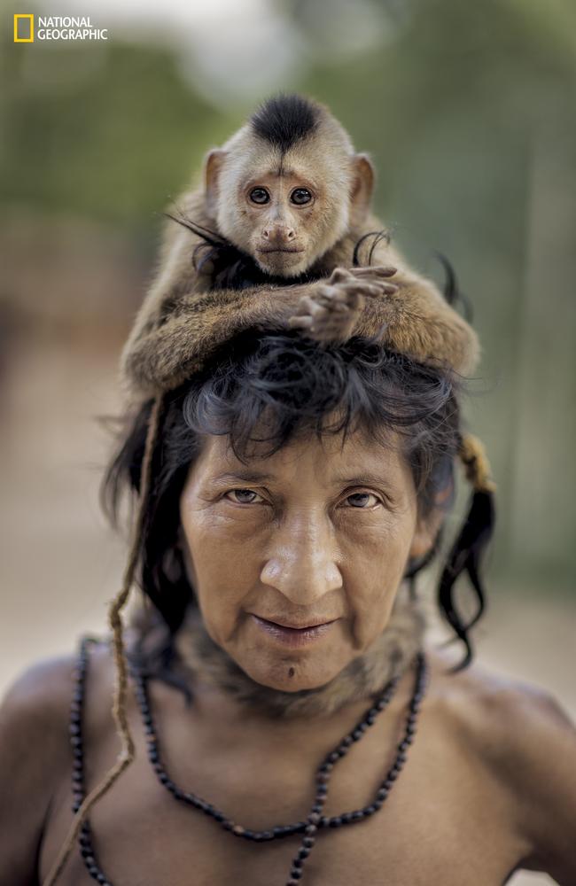 The photos give the outside world a rare insight into tribal life. Charlie Hamilton James/National Geographic