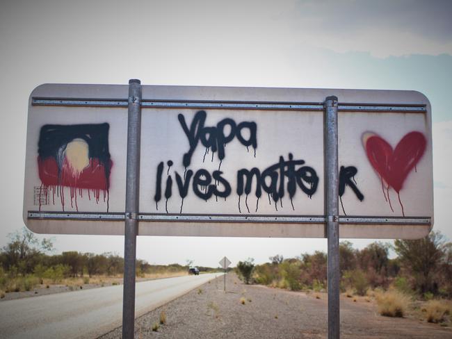 A sign on the Tanami Road to Yuendumu where Mr Walker was killed. Picture: Jason Walls