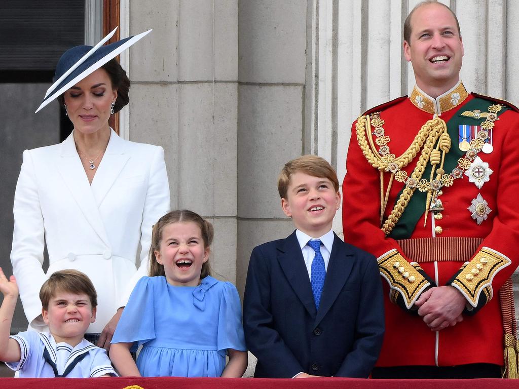 Prince William and Kate stand with their children on the Buckingham Palace balcony following the Queen's Birthday Parade last year. Picture: Daniel LEAL/AFP