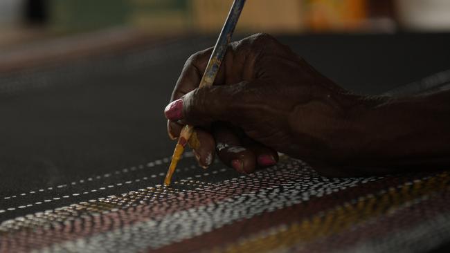 Artist paints at Pirlangimpi Art Centre. Picture: (A)manda Parkinson