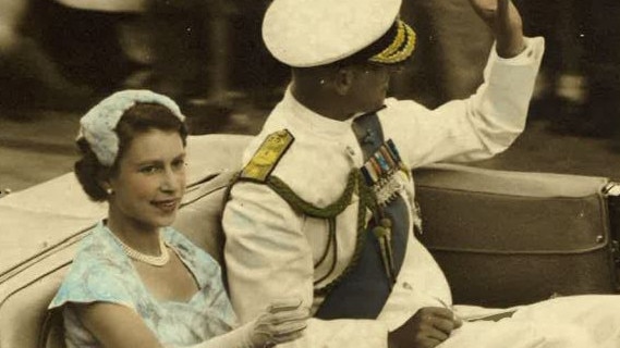 Queen Elizabeth II and Prince Philip driving through the streets of Brisbane during their 1954 Australian tour. Picture: Ray Lewty