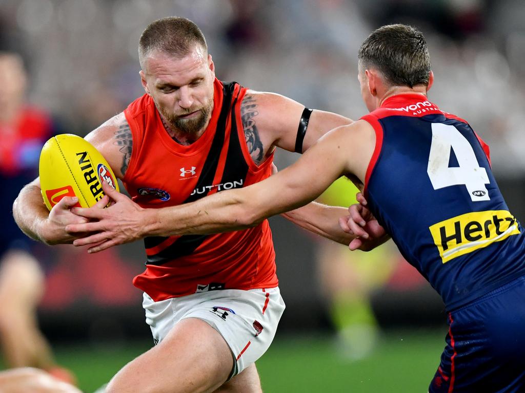 Jake Stringer tries to break away from Demon Judd McVee. Picture: Josh Chadwick/AFL Photos/via Getty Images