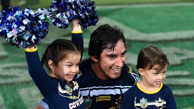 Johnathan Thurston of the Cowboys poses with his two daughters Frankie and Charlie after playing his last home NRL match at the end of the round 24 NRL match between the North Queensland Cowboys and the Parramatta Eels. Photo: Getty Images