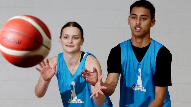 Andrea Heard from the Cairns Dolphins with Jordan Dudgeon. PICTURE: STEWART MCLEAN