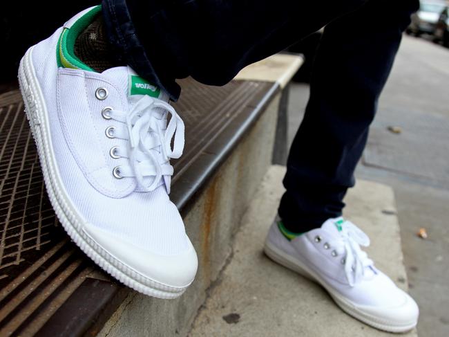 Ryan Black, a New York retailer, wears a pair of Dunlop Volleys Monday, August 16, 2010 in front of the Steven Alan Annex clothing store in the Tribeca neighborhood of New York City. Black enjoys the comfort of what many Australians may see as an everyday work shoe for comfort and good grip while on the job. Photo by CRaig Ruttle