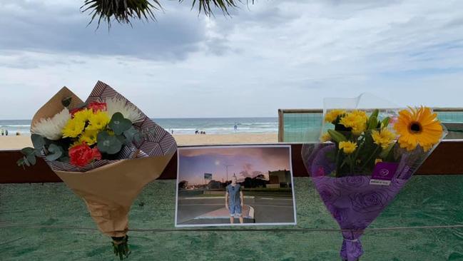 Friends farewelled Nick Slater during an intimate paddle out at Burleigh Heads.  Picture:  Laurie Minto