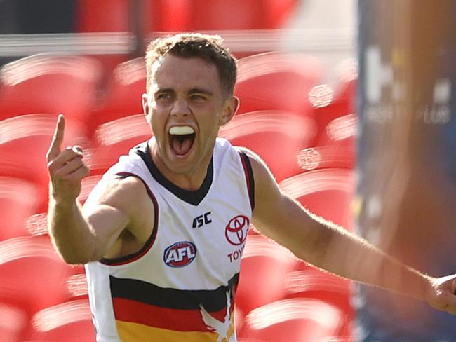 GOLD COAST, AUSTRALIA - SEPTEMBER 13: Lachlan Sholl of the Crows celebrates kicking a goal during the round 17 AFL match between the Carlton Blues and the Adelaide Crows at Metricon Stadium on September 13, 2020 in Gold Coast, Australia. (Photo by Chris Hyde/Getty Images)