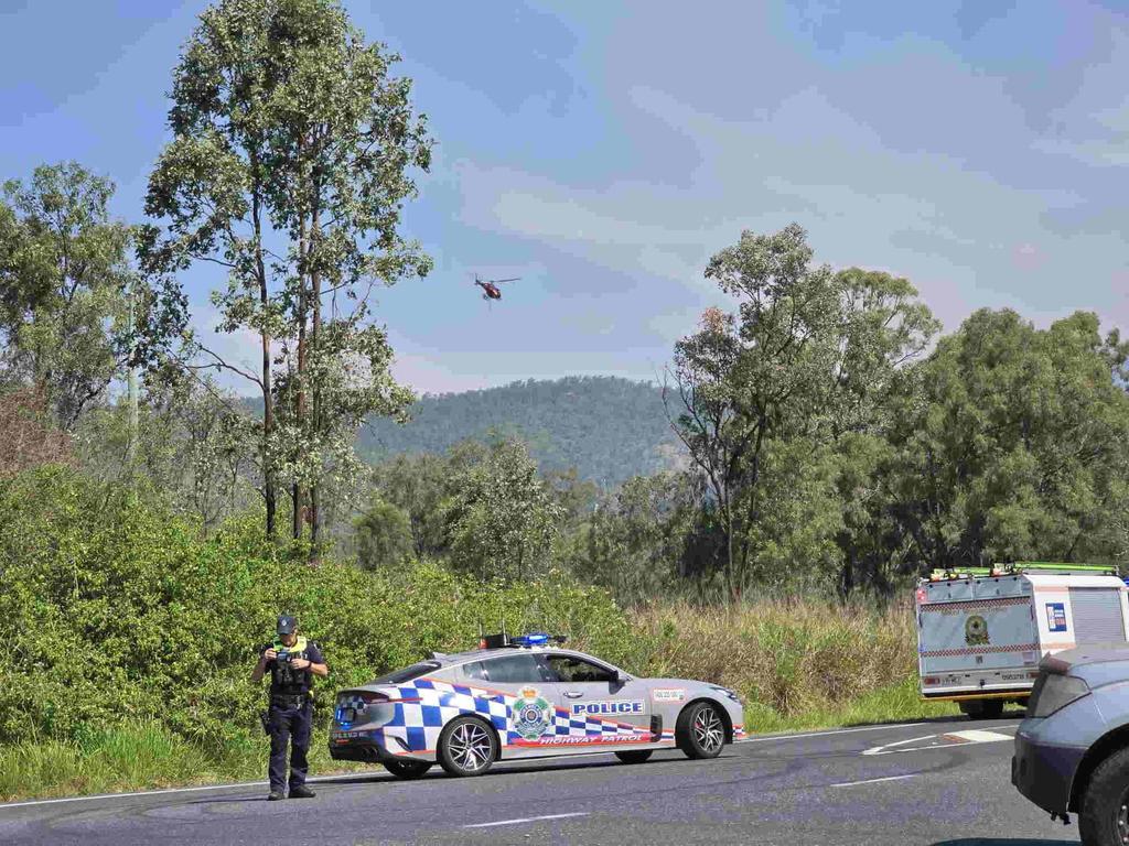 Emergency services at the scene of multiple fires on Mount Morgan range on September 22, 2024. SES have road blocks on the Burnett Hwy as Queensland Fire Brigade crews battle the fires, including using a helicopter to drop water from the air.