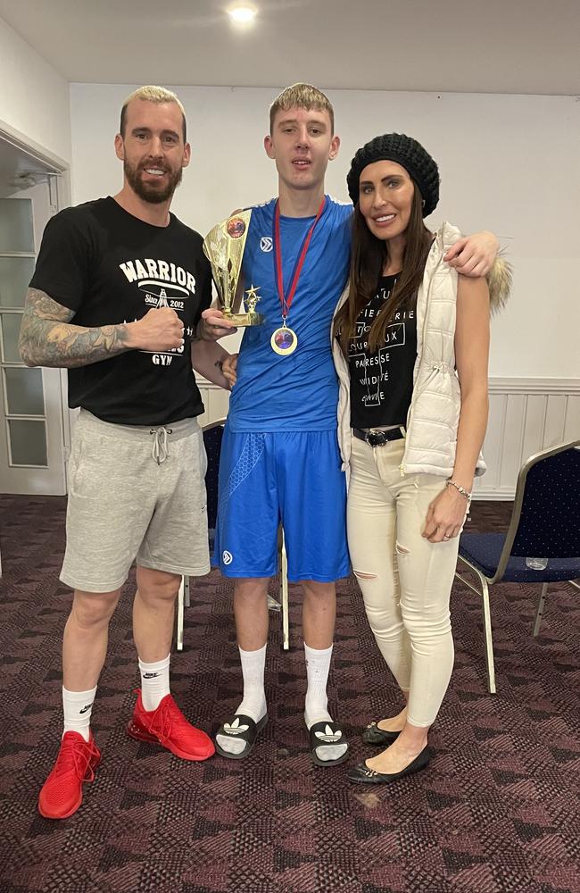 Warrior Boxing Gym young-gun Oscar Black, centre, with dad John Black, left, and mum Jo Black.