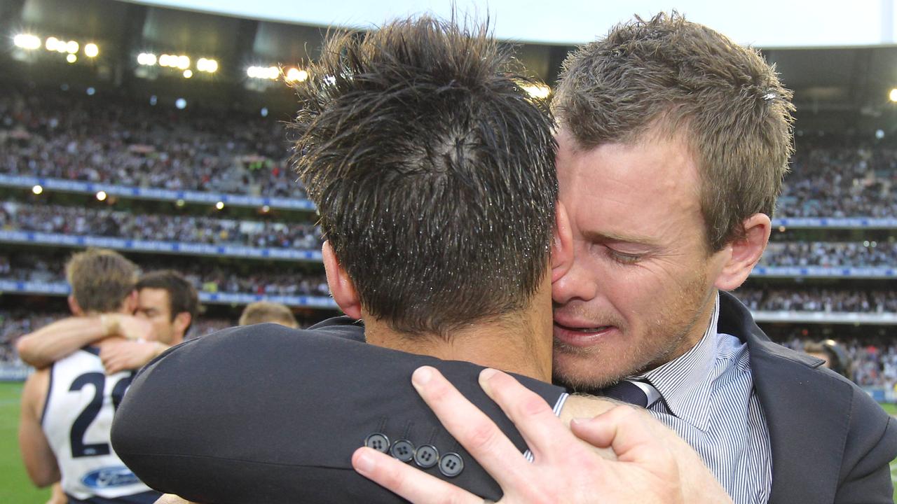 An emotional Cameron Mooney embraces Jimmy Bartel after the 2011 decider.