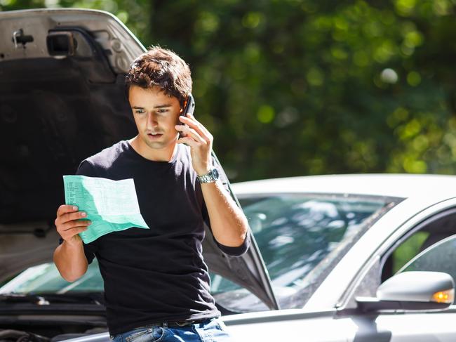 MOTORING: CAR BREAKDOWN Picture: istock Handsome young man calling for assistance with his car broken down by the roadside