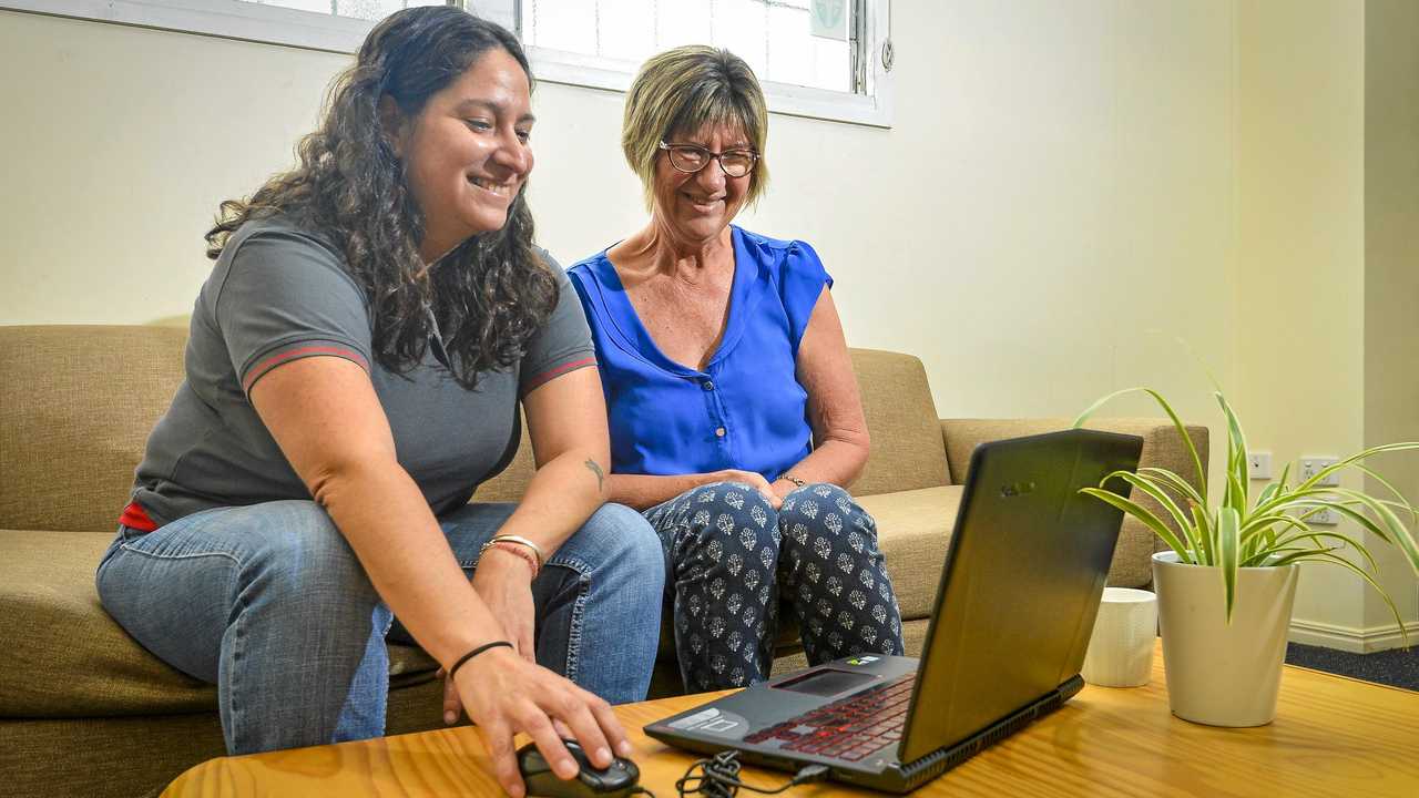 NEW WORLD: Welcoming Intercultural Neighbours' Natalia Muszkat assists Sue Churchill, who will take part in the Be Connected campaign to help "digitally exluded" individuals. Picture: Matt Taylor GLA151018CONN