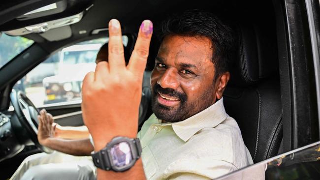 Sri Lankan President Anura Kumara Dissanayake shows his inked finger as he leaves a polling station after casting his ballot in Sri Lanka. Picture: AFP