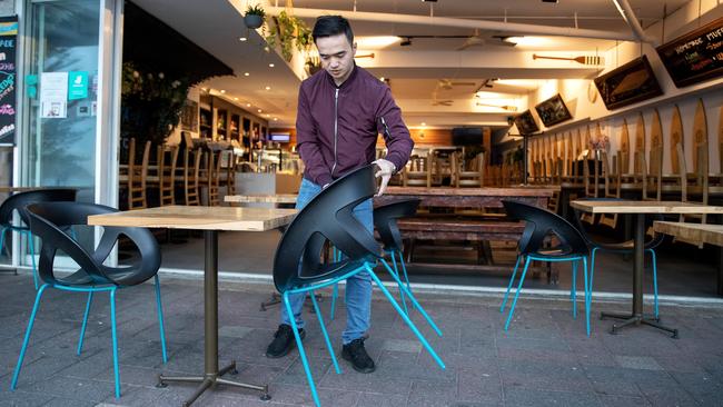 Chairs and tables are prepared for dine-in customers at Bluewater Cafe at Manly Beach as restrictions ease. Picture: Cameron Spencer.